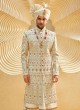 Wedding Wear Lucknowi Work Shrewani In Golden Cream Color